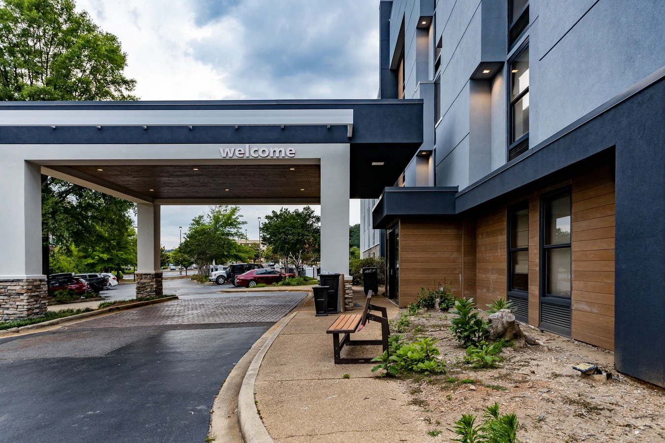 Photo of the exterior hotel renovation of the hampton inn in birmingham alabama showcasing the faux wood and architectural elements